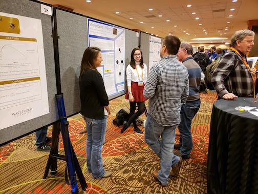 I and Amanda Jewell present our science to two interested Conference attendees. Image taken by Dr. Robert Harmon.